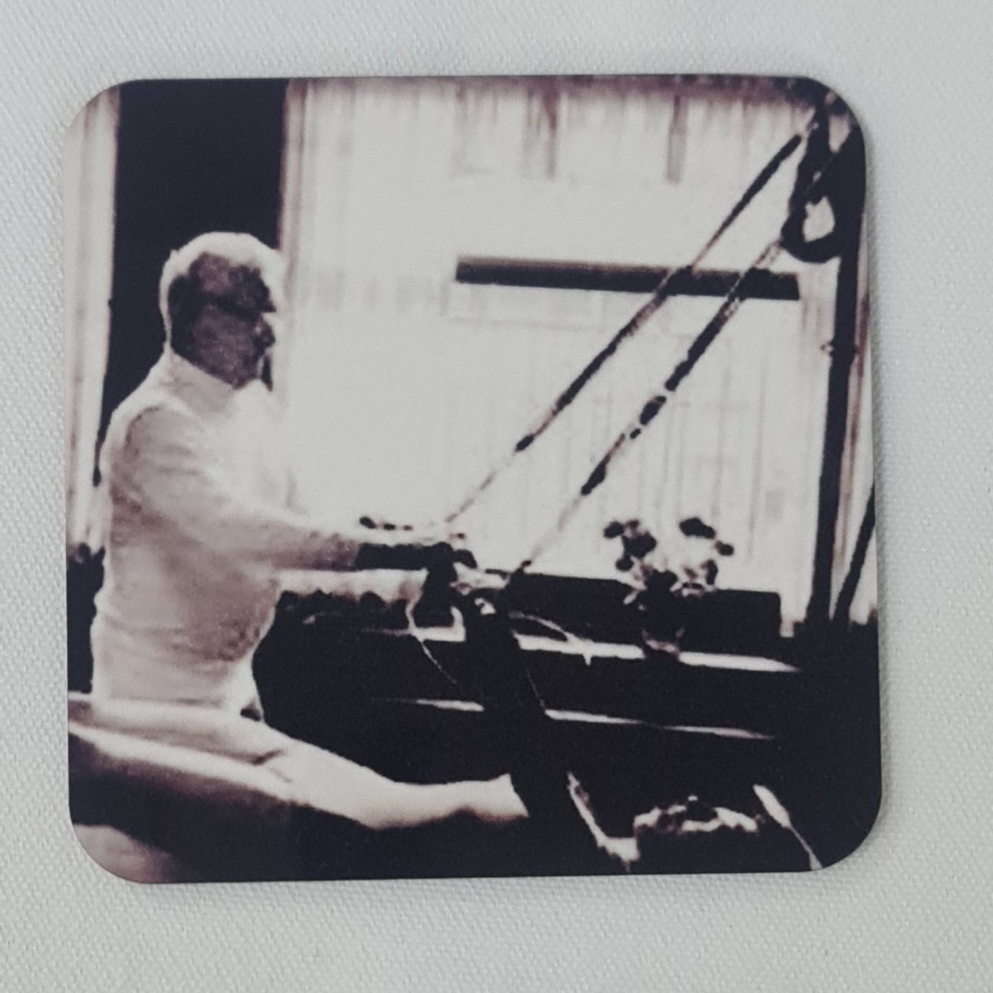 joseph pilates teaching a client on the trapeze bed to perform the breathing exercise - black and white classic