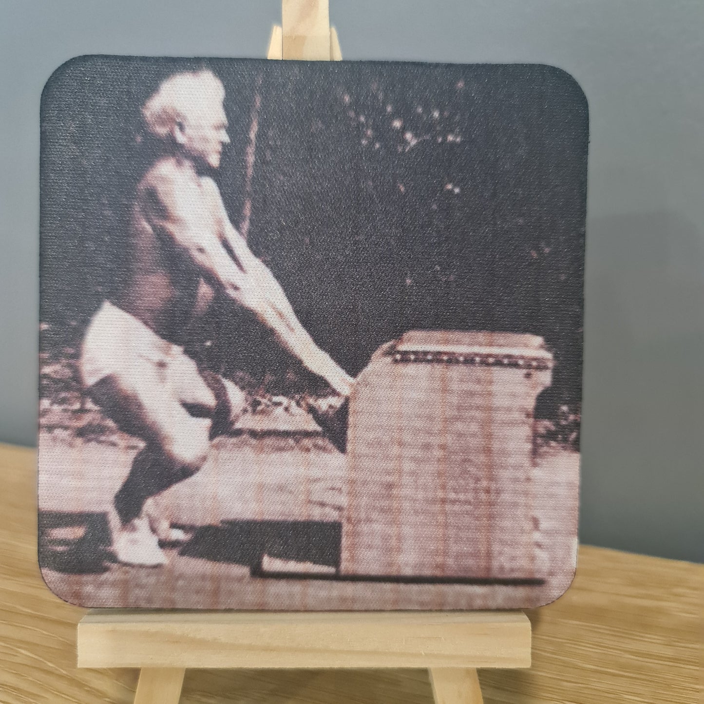 classic joseph pilates doing frog squat on the wunda chair -  photo on square neoprene coaster