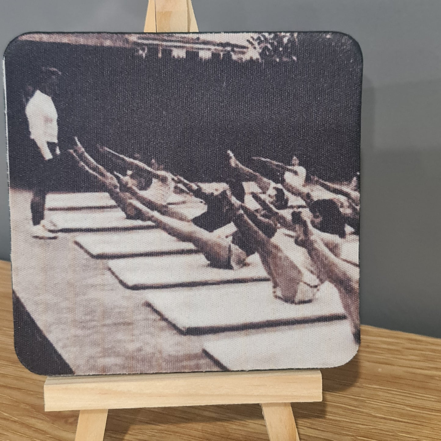  photo on square neoprene coaster - classic mat class doing the teaser pilates exercise taught by joseph pilates
