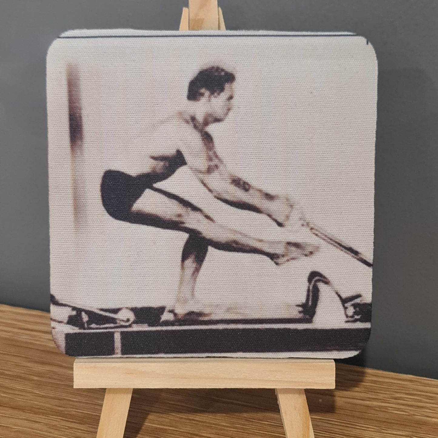  photo on square neoprene coaster - reformer exercise using a single leg squat - young joseph pilates