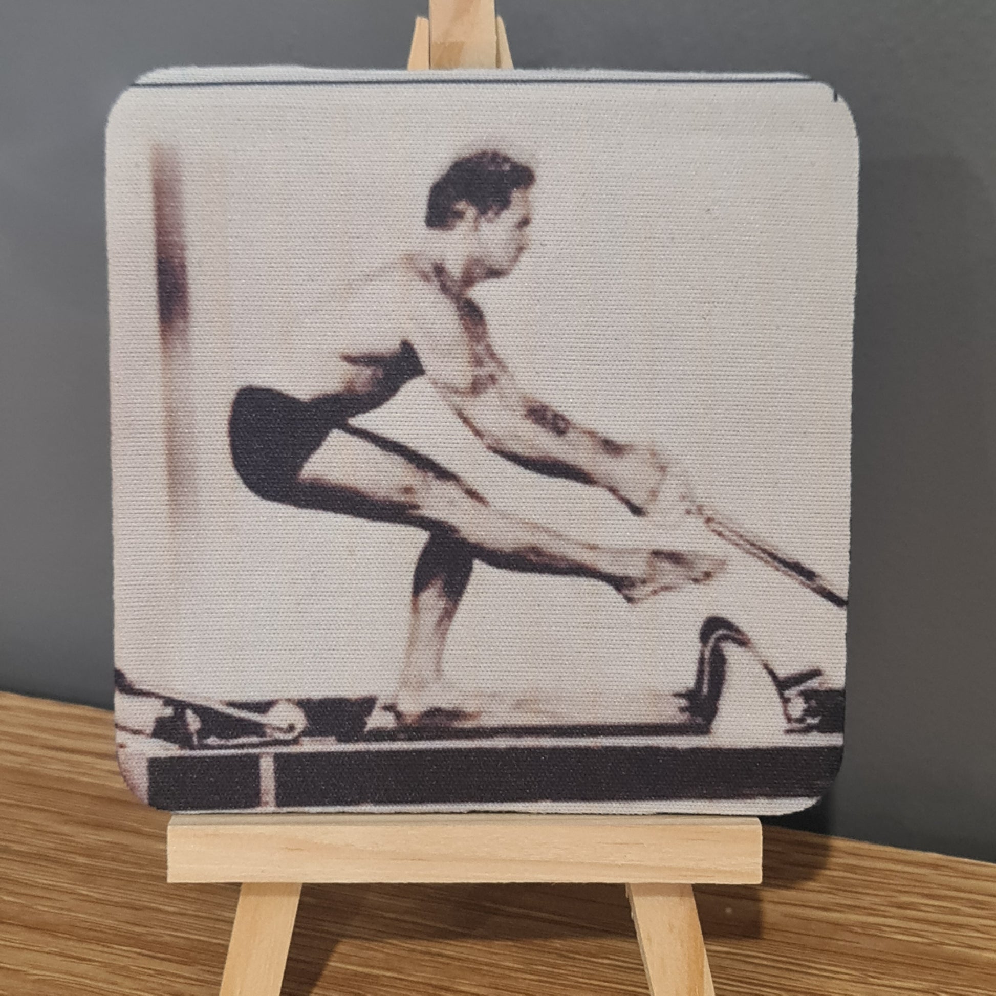  photo on square neoprene coaster - reformer exercise using a single leg squat - young joseph pilates