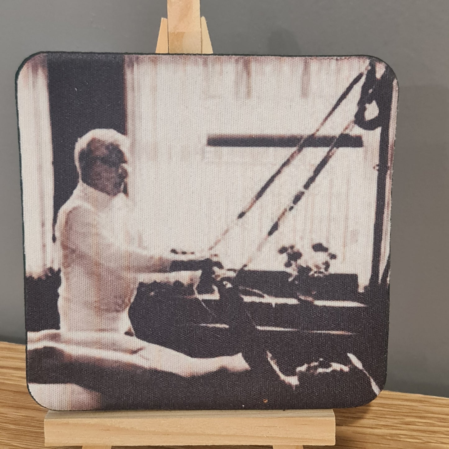 joseph pilates teaching the exercise 'breathing' on the trapeze table -  photo on square neoprene coaster