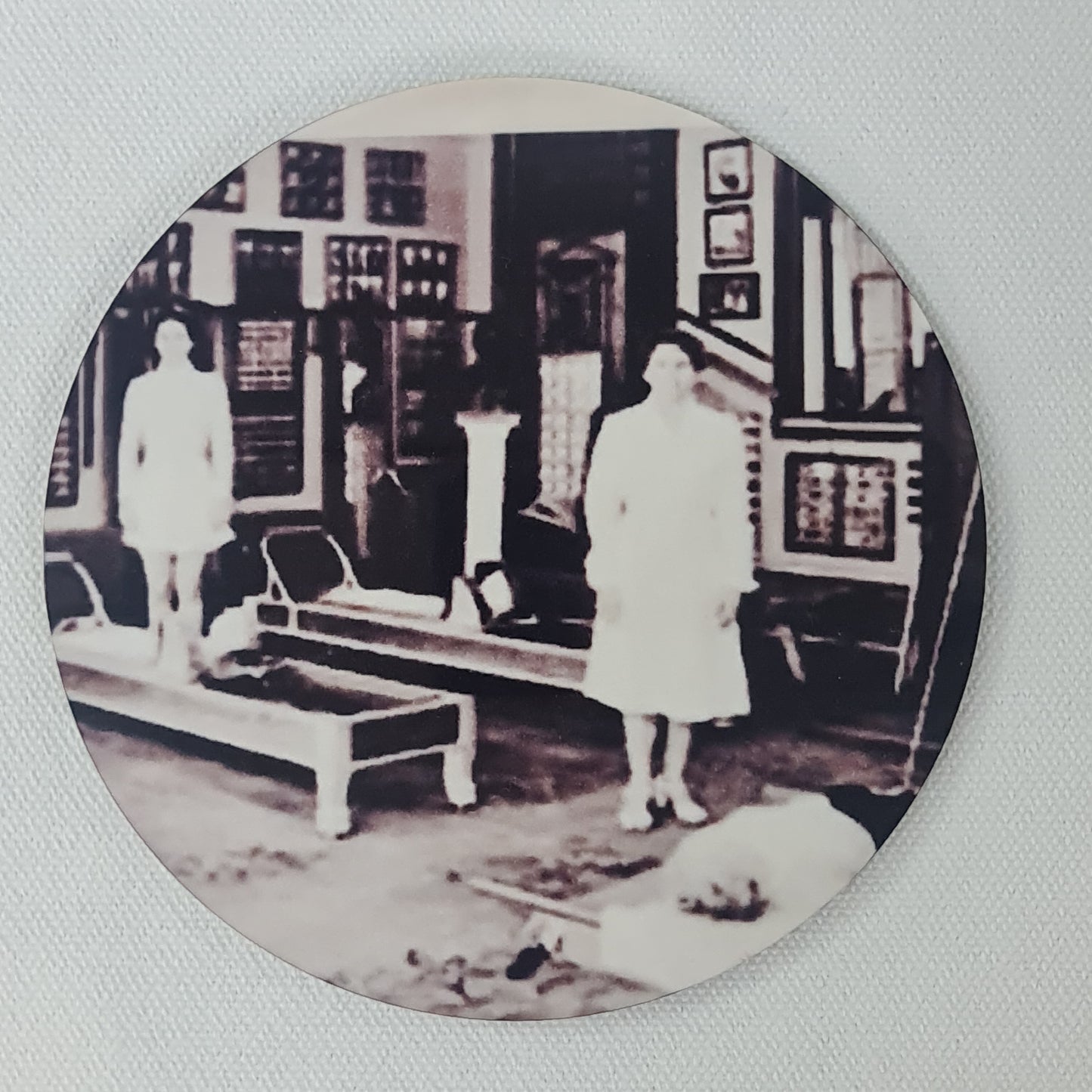 Round cork coaster featuring the classic pilates studio photo of joseph pilates